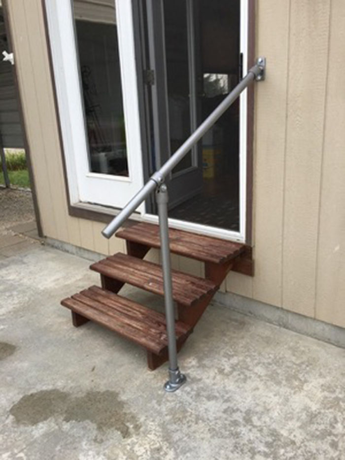 metal handrail kit that fixes onto wall and floor