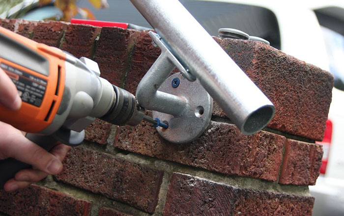 outdoor handrail mounted on a wall