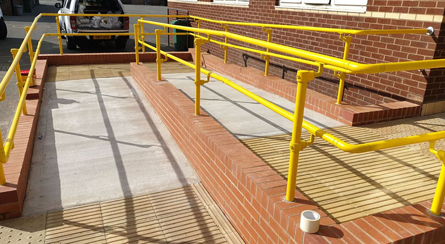 kee klamp yellow handrail on a ramp